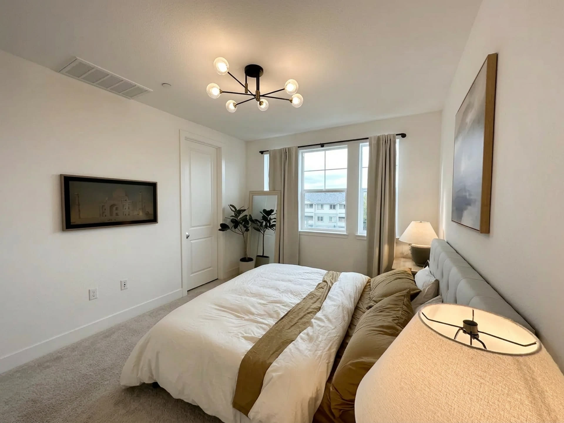 A guest bedroom window, looking out over the neighborhood.