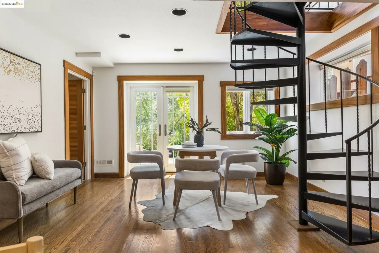 The dining room, with the spiral stair rising just beyond it.